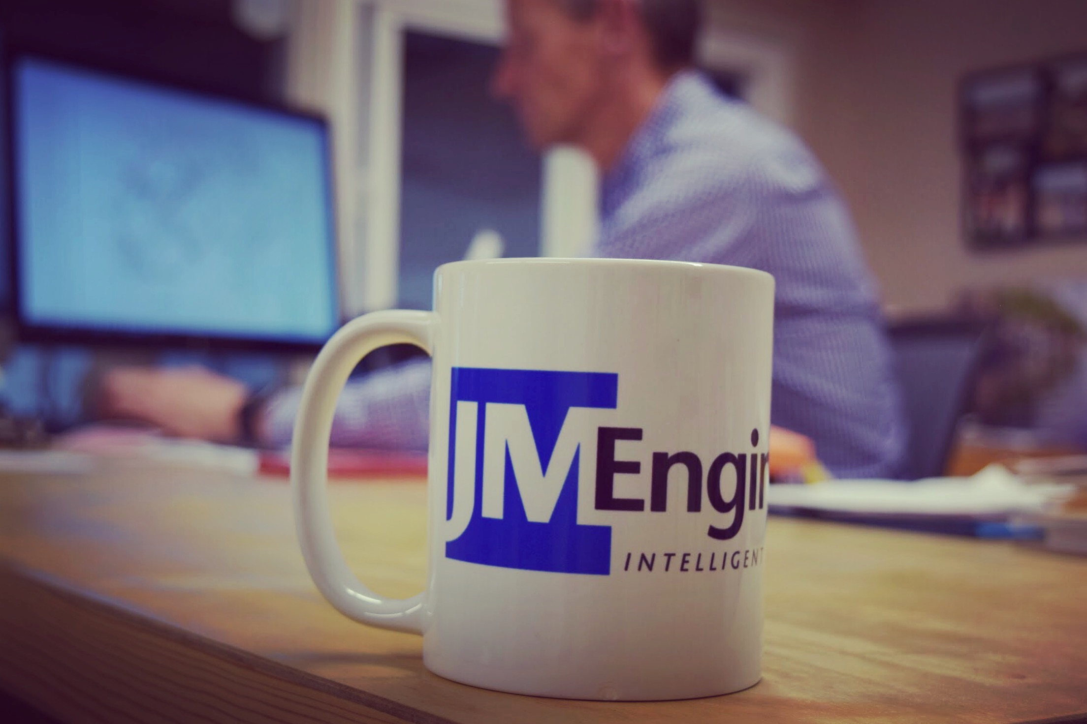 JM Engineering office John Melvin with mug